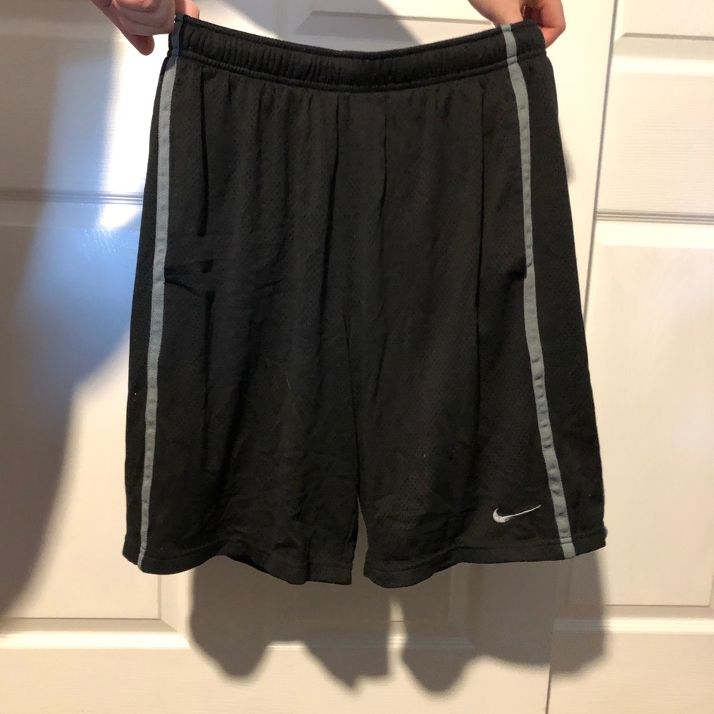 black nike shorts with gray stripes on side